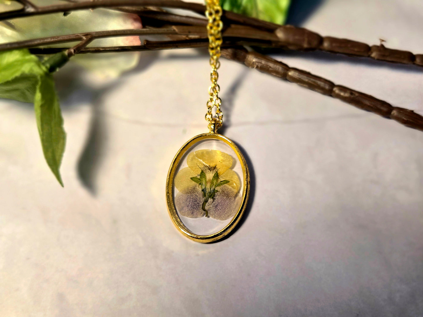 Pressed Flower Necklace – Real Yellow & Purple Blossom in Gold Oval Pendant