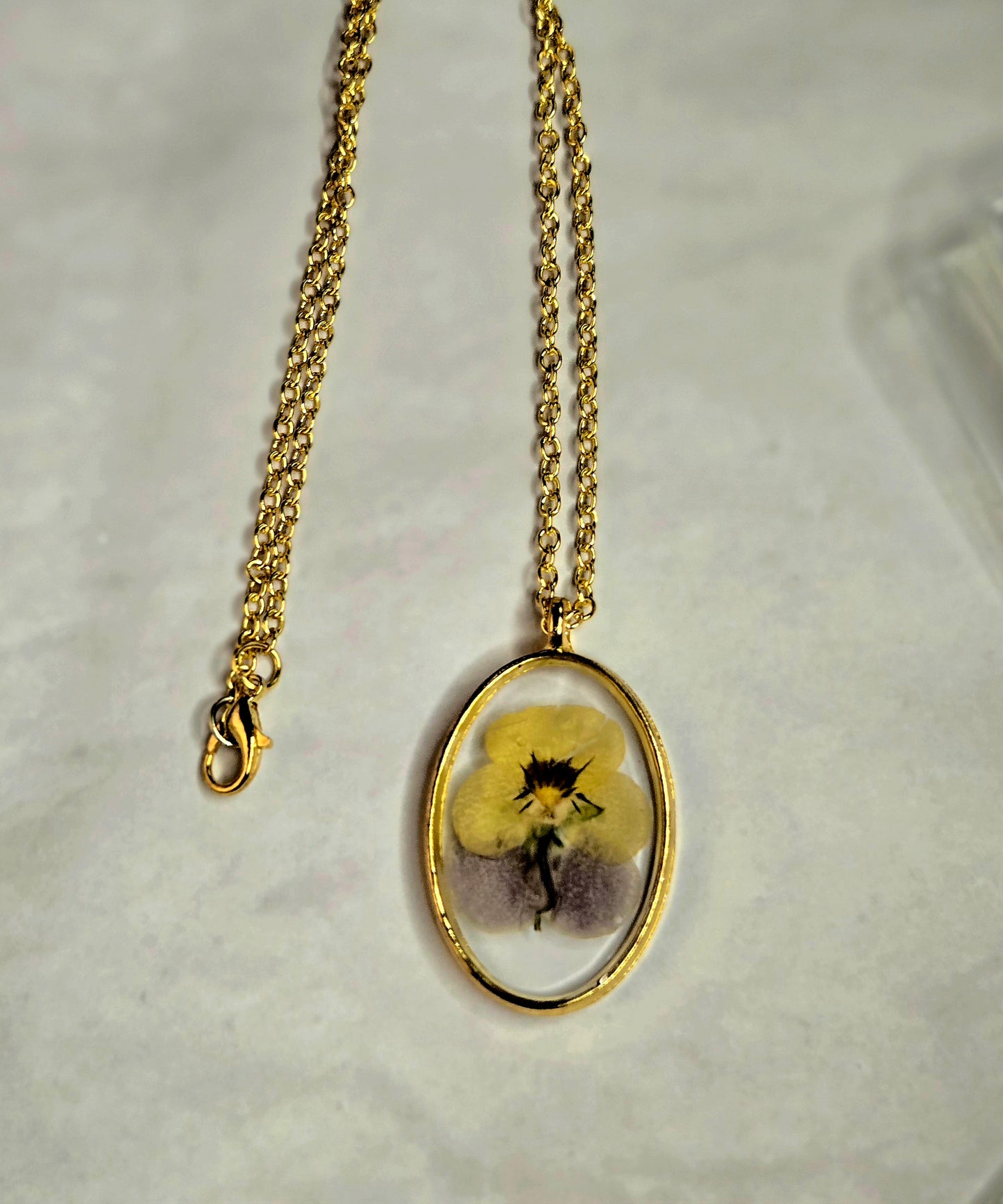 Pressed Flower Necklace – Real Yellow & Purple Blossom in Gold Oval Pendant