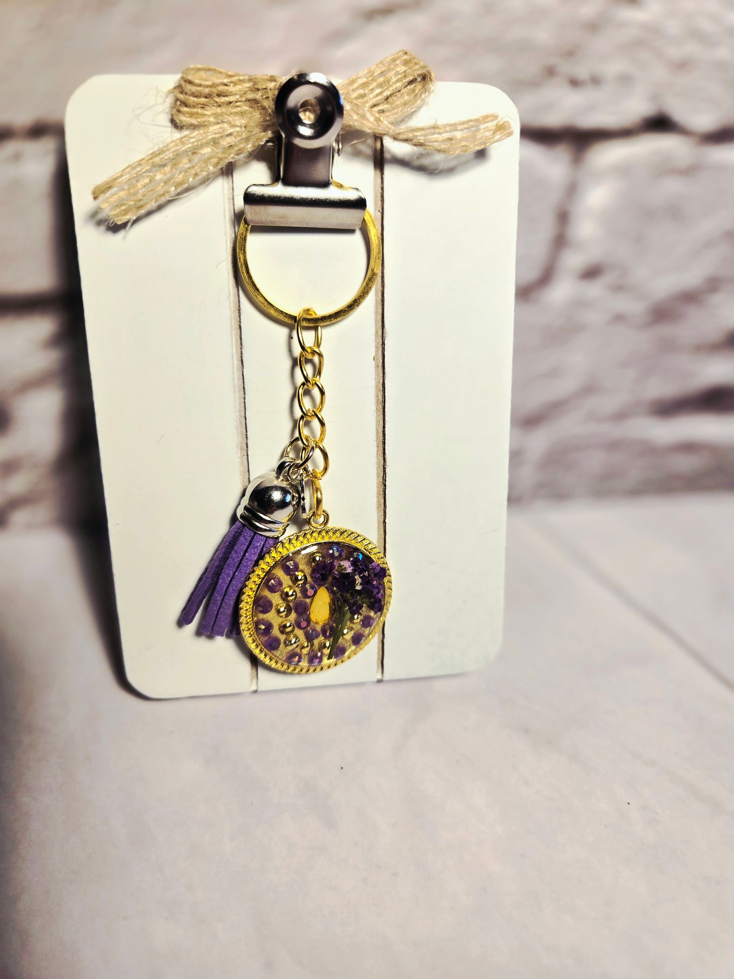 Gold Resin Keychain with Purple Tassel & Real Flower Accent
