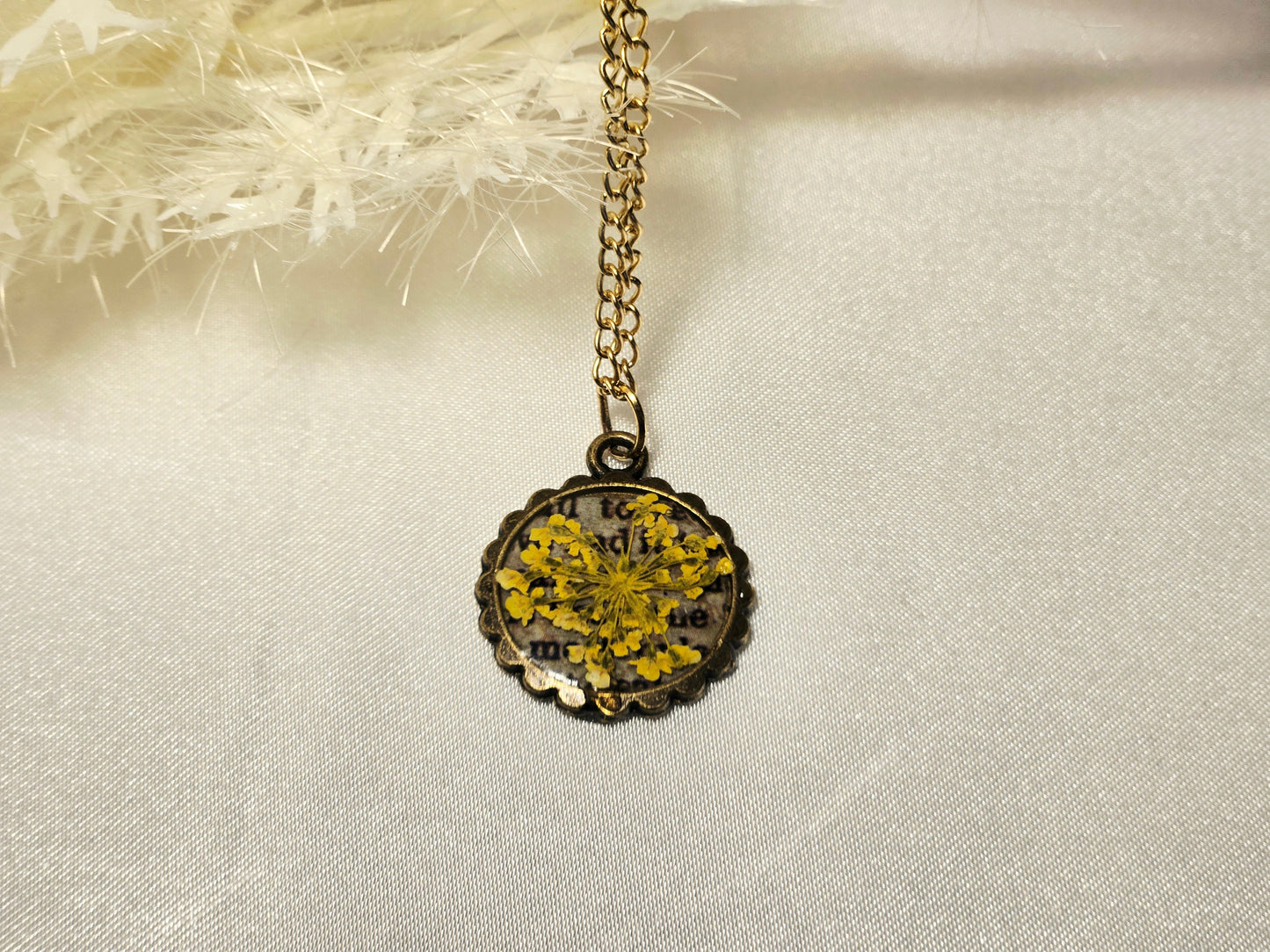 Pressed Yellow Flower Necklace – Vintage Bronze Botanical Pendant with Script Background