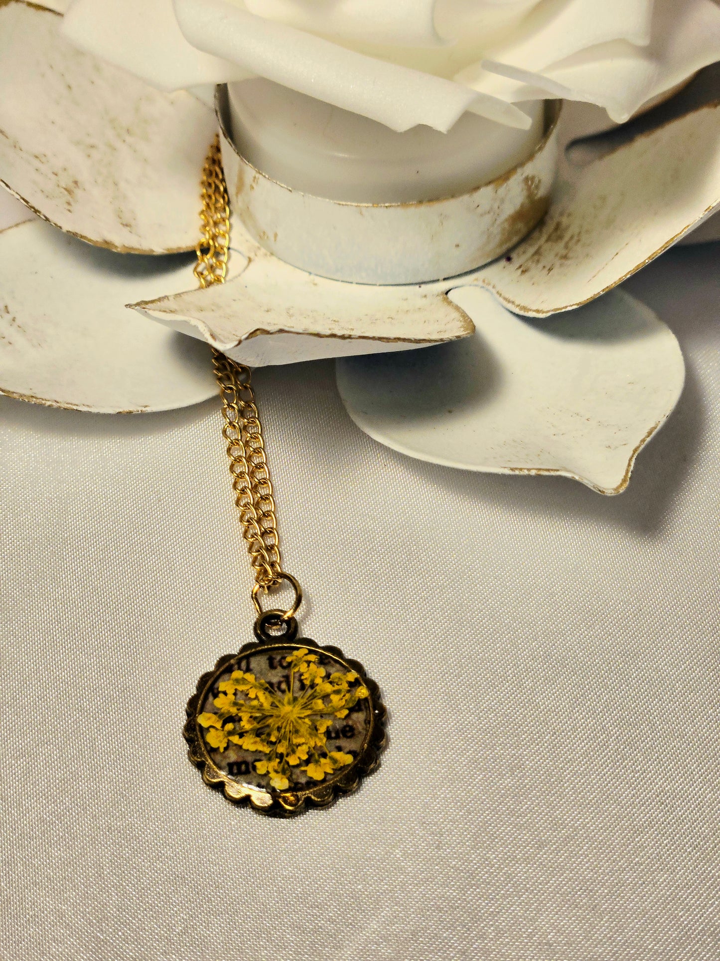 Pressed Yellow Flower Necklace – Vintage Bronze Botanical Pendant with Script Background