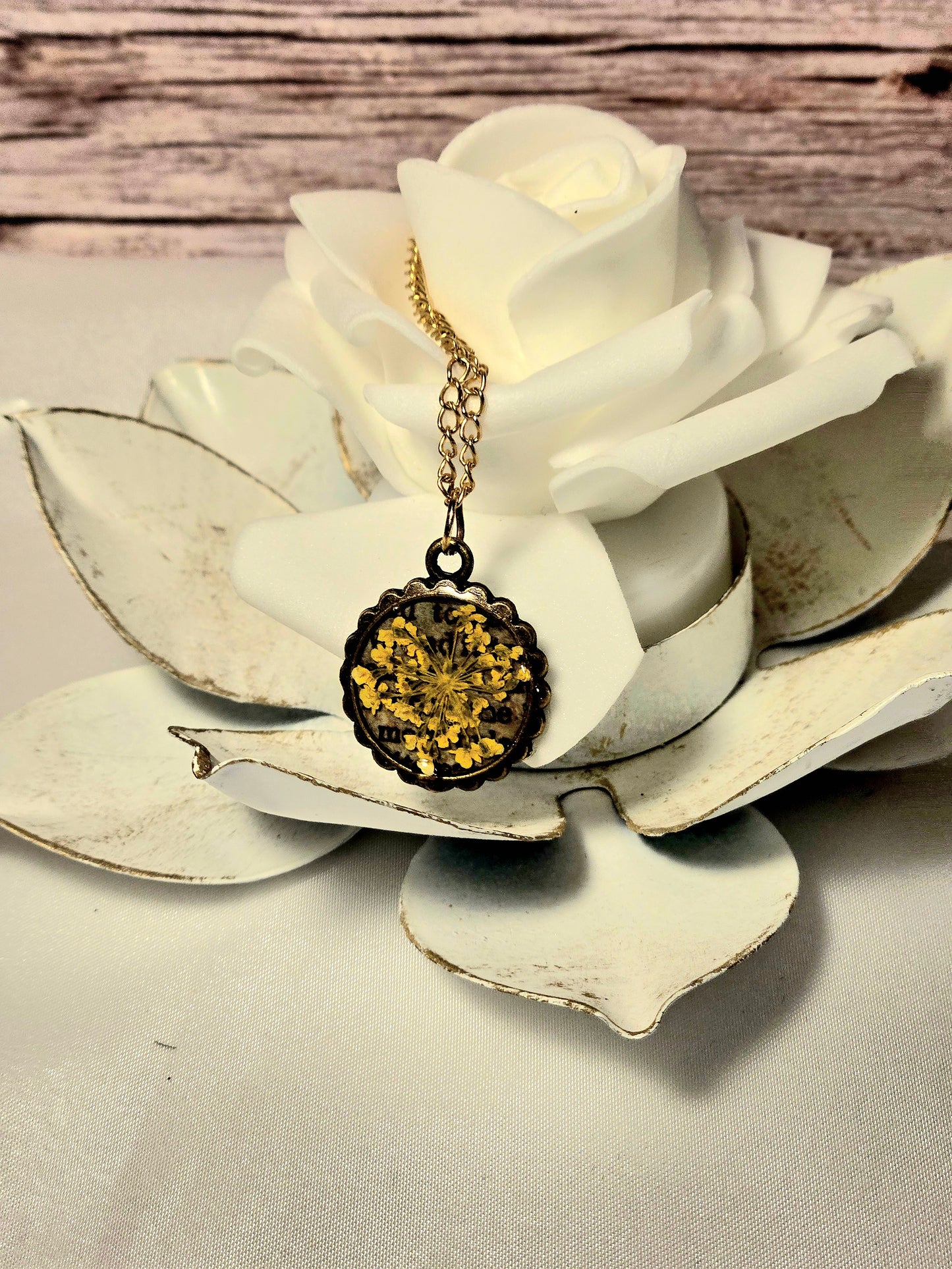 Pressed Yellow Flower Necklace – Vintage Bronze Botanical Pendant with Script Background