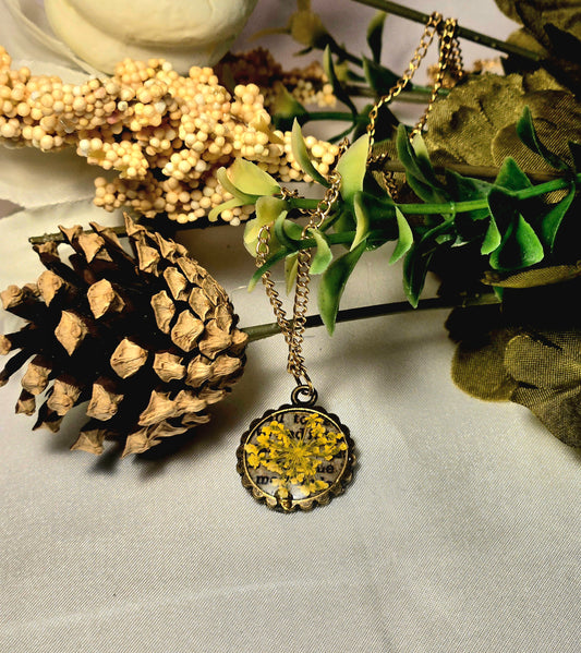 Pressed Yellow Flower Necklace – Vintage Bronze Botanical Pendant with Script Background