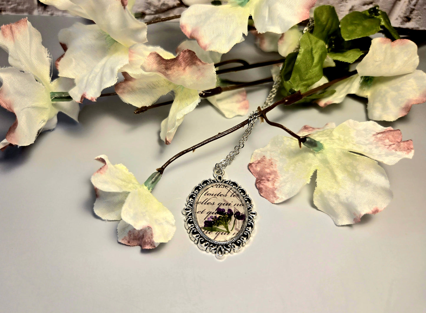 Vintage Floral Necklace with Real Purple Flowers and Script Background – Antique Style Oval Pendant – Botanical Jewelry Gift for Her