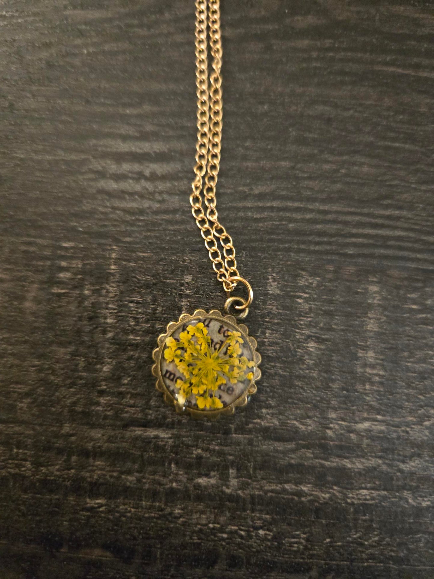 Pressed Yellow Flower Necklace – Vintage Bronze Botanical Pendant with Script Background